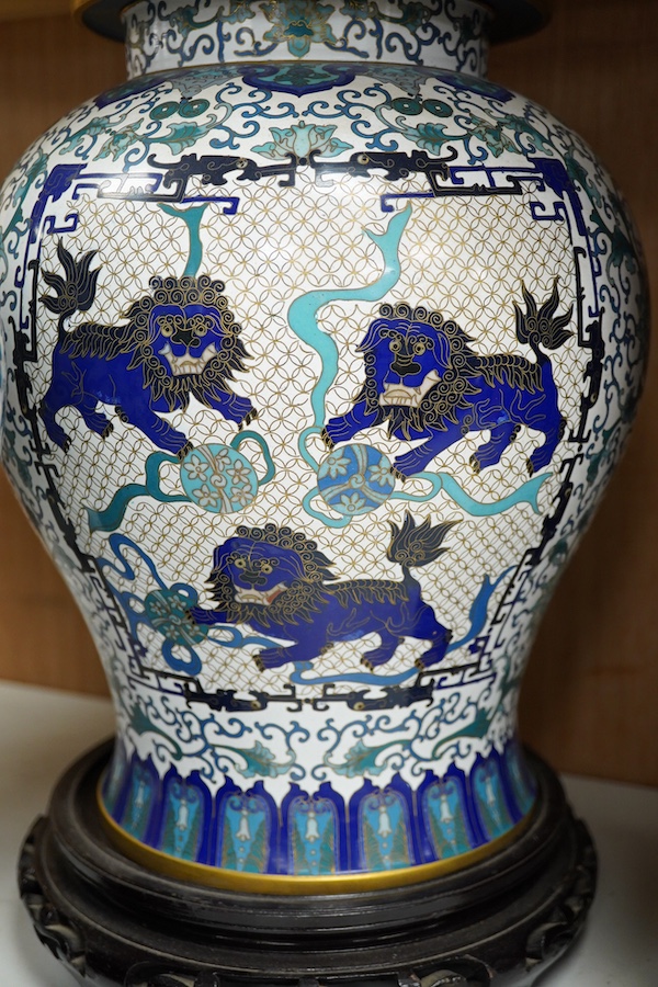 A pair of Chinese blue and white dragon decorated cloisonné enamel jars and covers on stands, 45cm high and a Japanese enamelled porcelain vase, early 20th century. (3). Condition - good